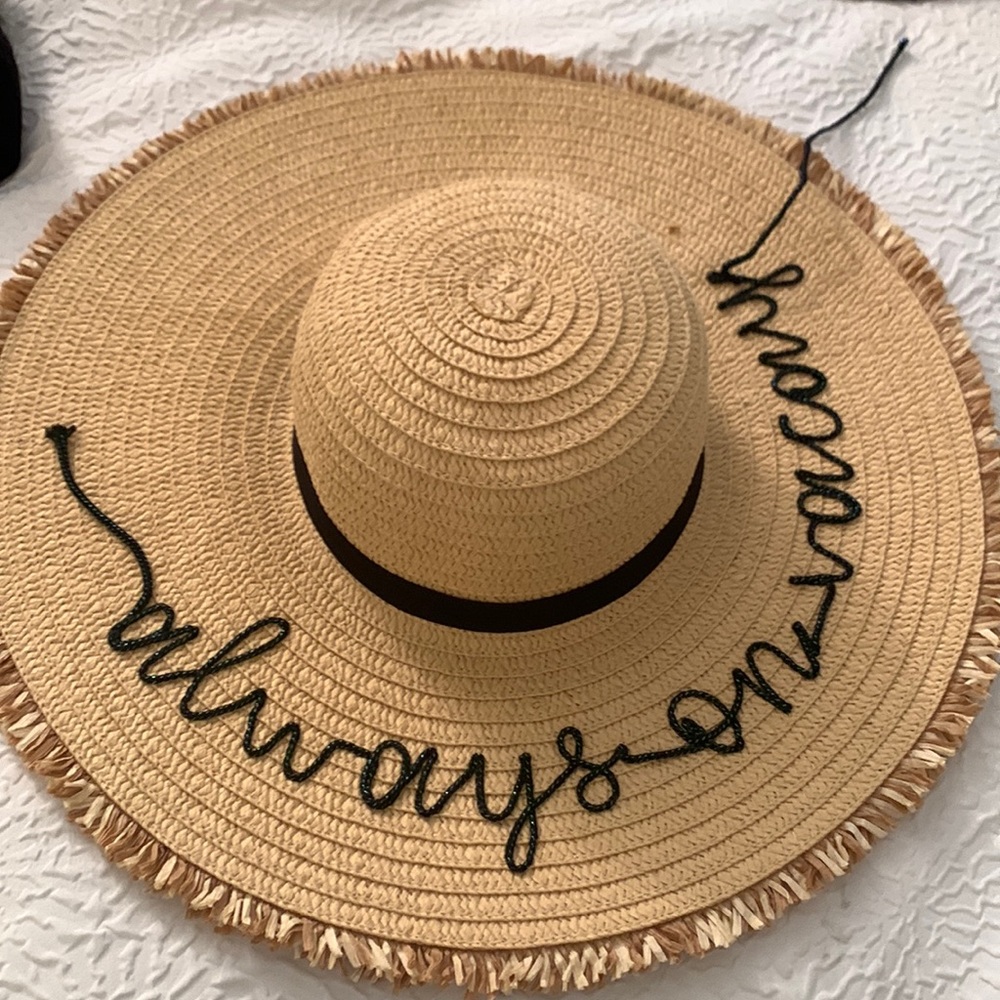 Hat “always on vacay”